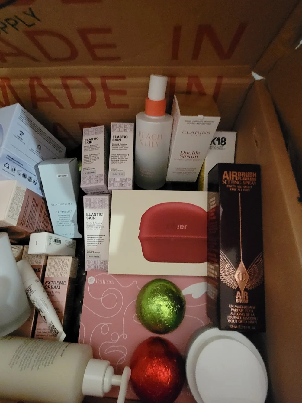 A Box Full Of Many High End Facial Items & Women's 8 Piece White Makeup Brushes